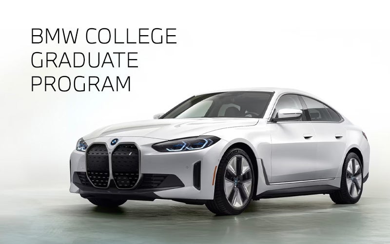 White BMW i4 parked. BMW College Graduate Program. | BMW of Madison in Madison WI